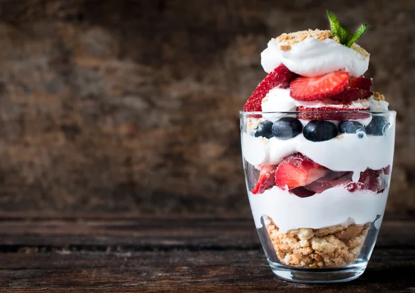 Sweet dessert in glass with biscuit