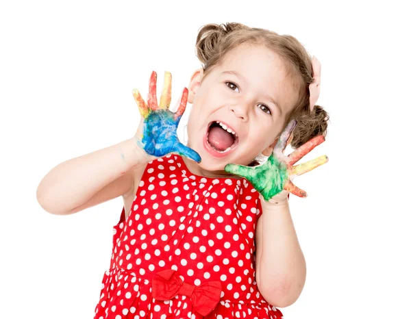 Glückliches kleines Mädchen mit bunten Händen — Stockfoto