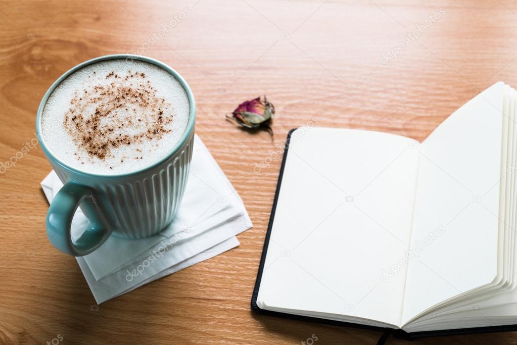 Coffee Cup And Notebook On Wooden Table With Copy Space