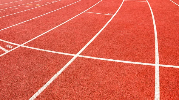 red running track on athletic stadium