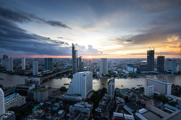 Bangkok city - Beautiful sunset curve Chao Phraya River panoramic Cityscape urban of Bangkok city at night , panorama landscape Thailand