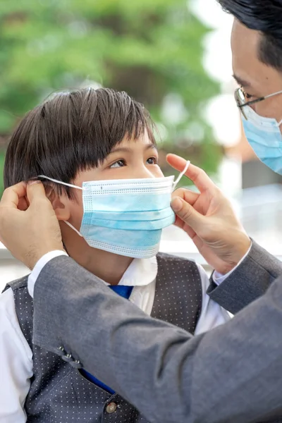 Father Putting Protective Mask His Son Asian Family Wearing Face — Stock Photo, Image