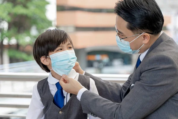 Father Putting Protective Mask His Son Asian Family Wearing Face — Stock Photo, Image