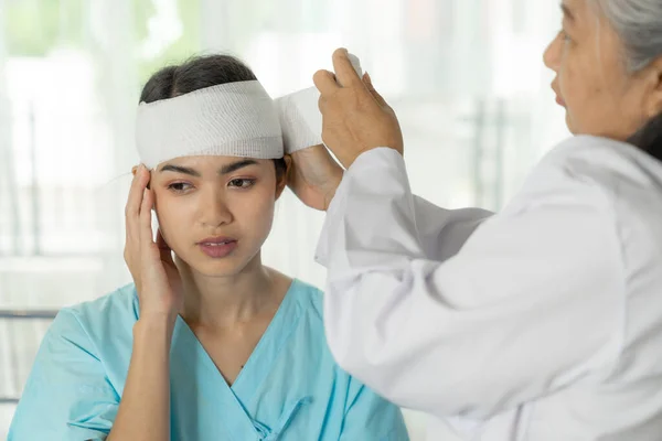 accident patients injury headache woman in hospital - medical concept