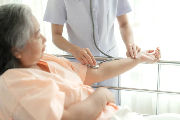 Doctor Examining Senior Elderly Female Patient Hospital Bed Patients Medical — 스톡 사진