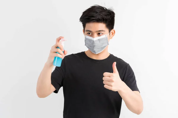 Hombre Asiático Con Máscara Facial Sosteniendo Alcohol Para Lavarse Las —  Fotos de Stock