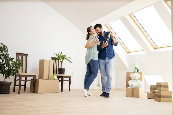 Young Caucasian Couple Dancing Opening Champagne Bottle Celebrate Moving New —  Fotos de Stock