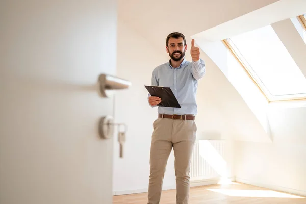 Portrait Handsome Real Estate Agent Holding Thumbs New House — Stockfoto