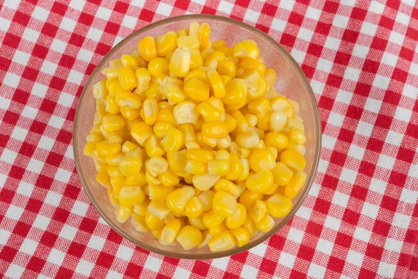 Yellow corn in a glass bowl — Stock Photo, Image