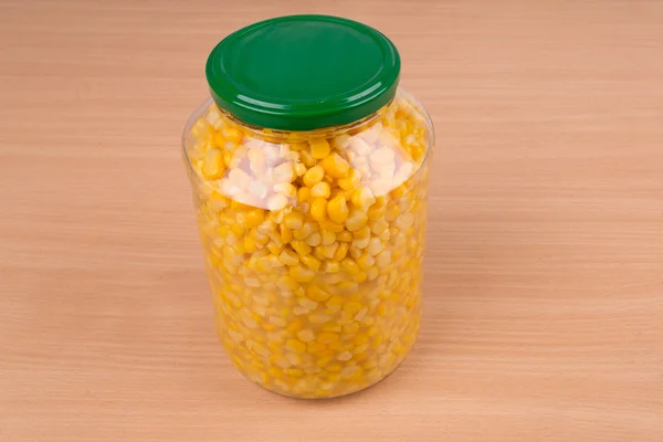 Yellow corn in glass jar — Stock Photo, Image