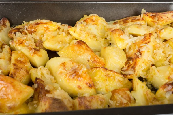 Fried potatoes on a baking sheet — Stock Photo, Image