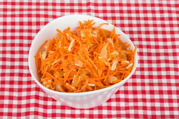 Grated carrot with pineapple on the tablecloth — Stock Photo, Image