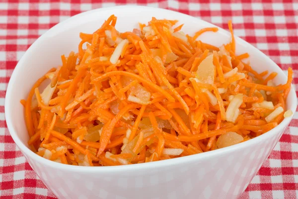 Grated carrot with pineapple on the tablecloth — Stock Photo, Image