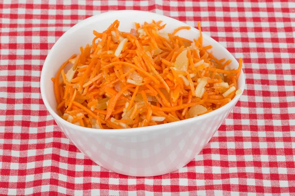 Grated carrot with pineapple on the tablecloth — Stock Photo, Image