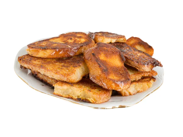 Fried bread in the milk on a plate — Stock Photo, Image