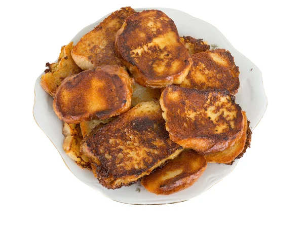 Fried bread in the milk on a plate — Stock Photo, Image