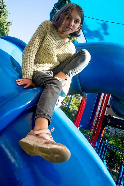 Beautiful Teenage Girl Sits Thoughtfully Top Children Slide Shade Sunny — Stock Photo, Image