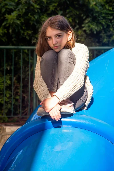 Beautiful Teenage Girl Sits Thoughtfully Top Children Slide Shade Sunny — Stock Photo, Image