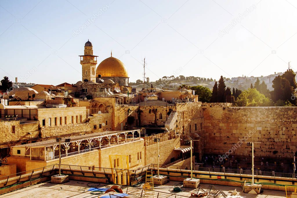 Western wall and Minaret and Dome of the Rock on a sunny day
