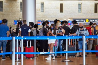 tel aviv - august 01, 2021: people in aeroport Ben Gurion clipart