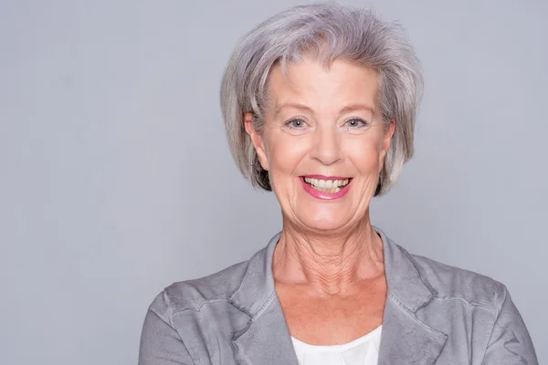 Senior woman smiling — Stock Photo, Image