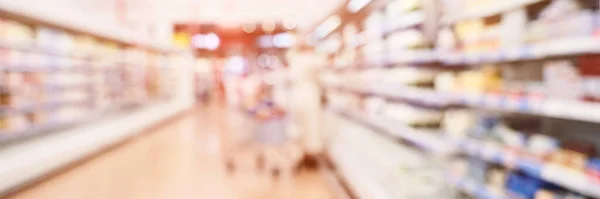 Food market interior. Blur corridor background. Shop shelf. Stock goods. — Stock Photo, Image