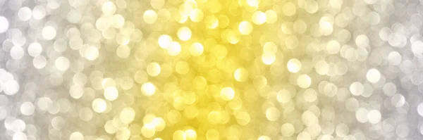 Bokeh circle with gold sparkles background. Yellow and grey glitter backdrop