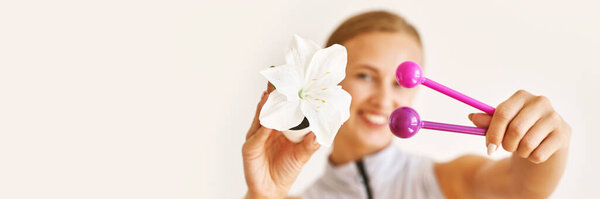 Young woman hand holding femine toys. Kegel adult exercise. Intimate gymnastics