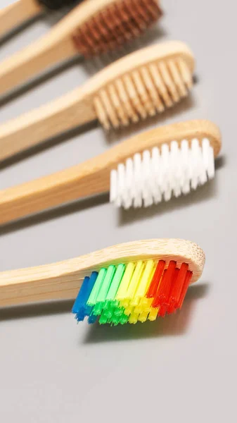 Set of ecology toothbrush on grey background. Different color. — Stock Photo, Image