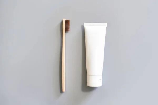 Ecology toothbrush on grey background. Brush on table. Sustainable mouth product — Stock Photo, Image