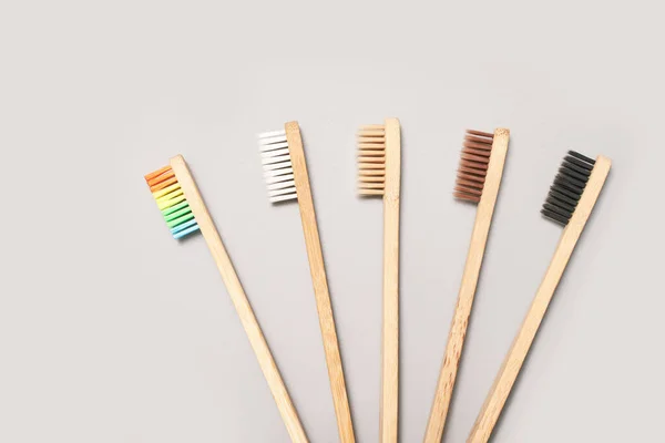 Set of ecology toothbrush on grey background. Different color. — Stock Photo, Image