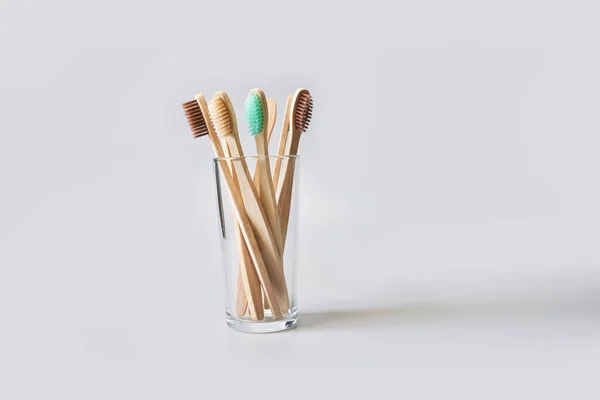 Set of ecology toothbrush on grey background. Different color glass. Diversity — Stock Photo, Image