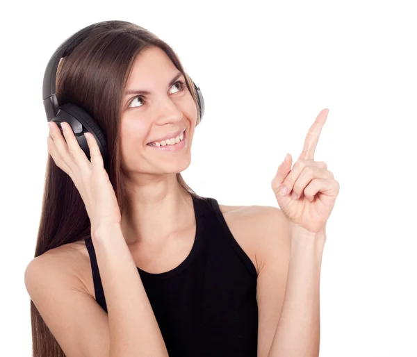 A woman with headphones listening to music and finger up — Stock Photo, Image