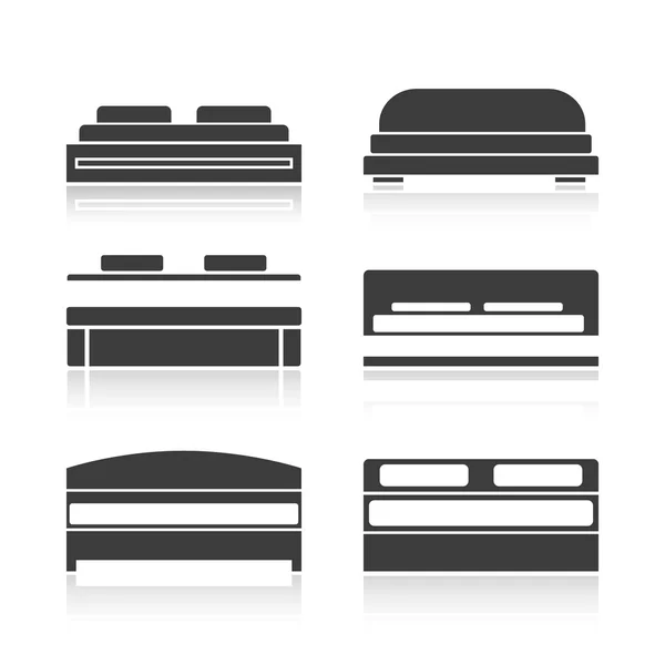 Conjunto de siluetas negras cama — Vector de stock