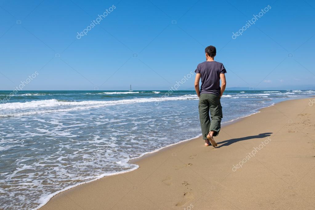 People Walking On The Beach