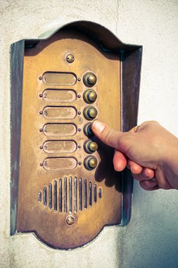 Finger ringing a door bell clipart