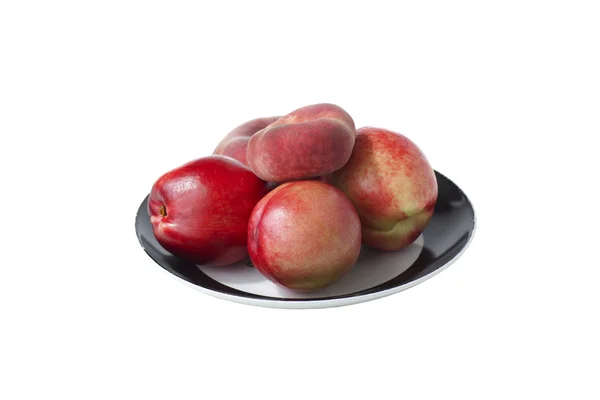 Peaches and nectarines on the plate. — Stock Photo, Image