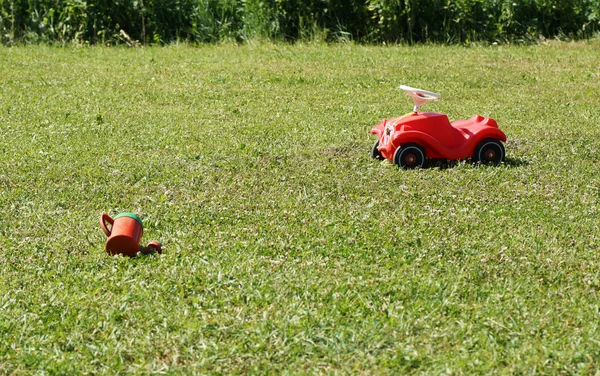 Children's toys on the lawn. — Stock Photo, Image