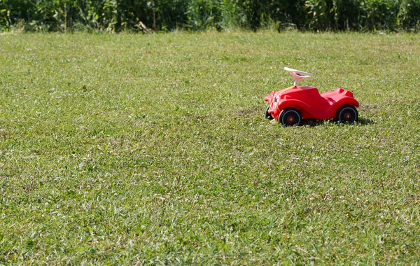 Toy car on the lawn. — Stock Photo, Image