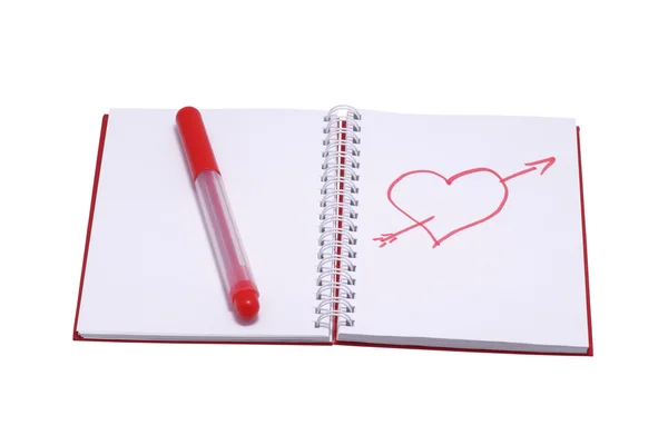 Figure heart in a notebook and a red felt-tip pen. — Stock Photo, Image