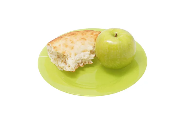 Eple og et stykke brød på tallerkenen . – stockfoto