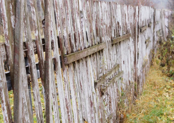 Old wooden fence with a gate. — Stock Photo, Image