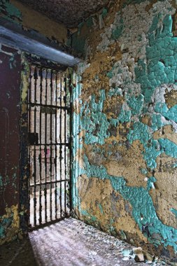 Cell block of the inside of an old prison no longer in use clipart