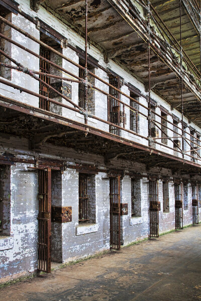 Cell block of the inside of an old prison no longer in use