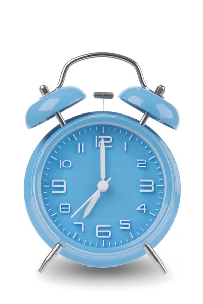 Blue alarm clock with the hands at 7 am or pm isolated on a white background, One of a set of 12 images showing the top of the hour starting with 1 am / pm and going through all 12 hours — Stok fotoğraf