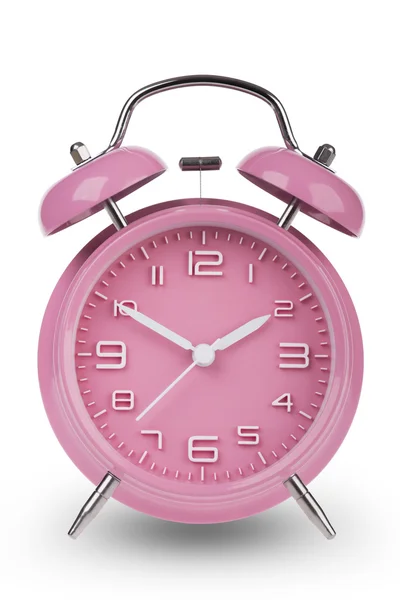 10 と 2 pm は、白い背景で隔離を手でピンクの目覚まし時計 — ストック写真