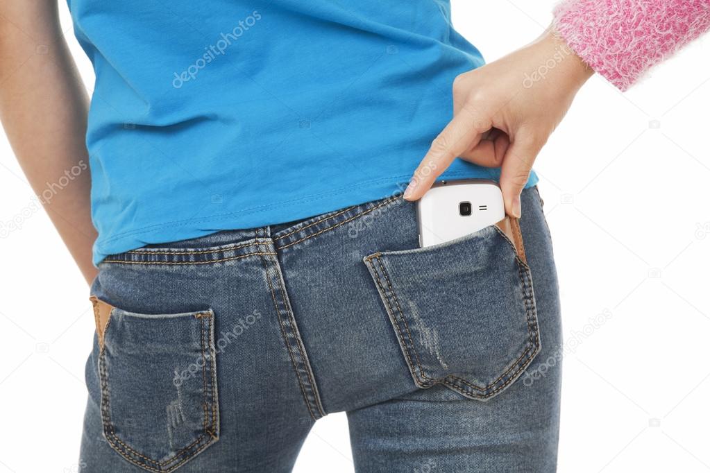 Sexy woman with a cell phone in her back pocket and a thief in trying to steal it on a white background