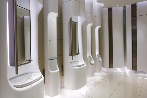 Contemporary mens public restroom in an upscale shopping centre. — Stock Photo, Image