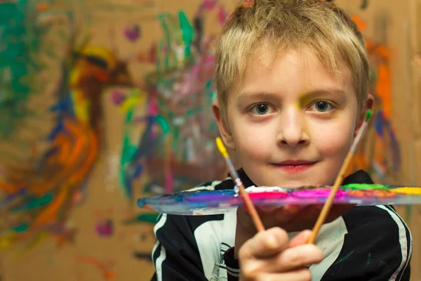 Boy and paints — Stock Photo, Image