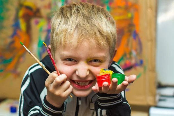 Boy and paints — Stock Photo, Image